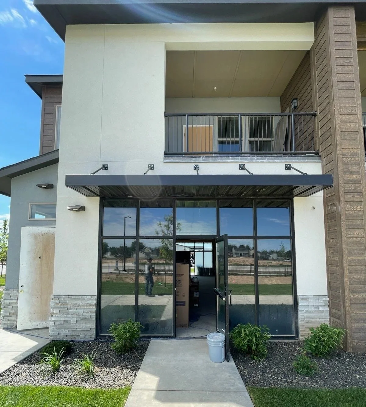 storefront door. door service. bronze anodized. gray glass