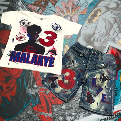 Graphic t-shirt and denim shorts with a '3' and 'K' initials, Marvel-themed comics in the background.