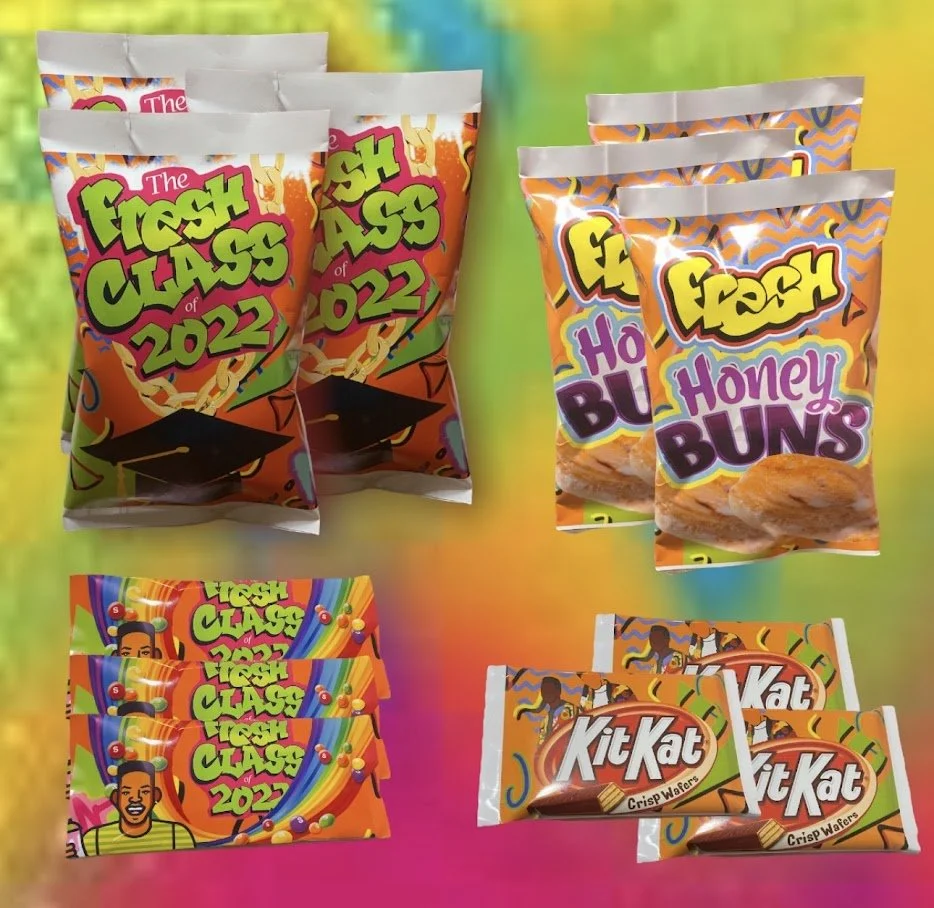 Various snack packages for a graduation-themed celebration, including 'The Fresh Class of 2022' snack bags, 'Honey Buns', and 'Kit Kat' chocolate bars, arranged on a colorful background.