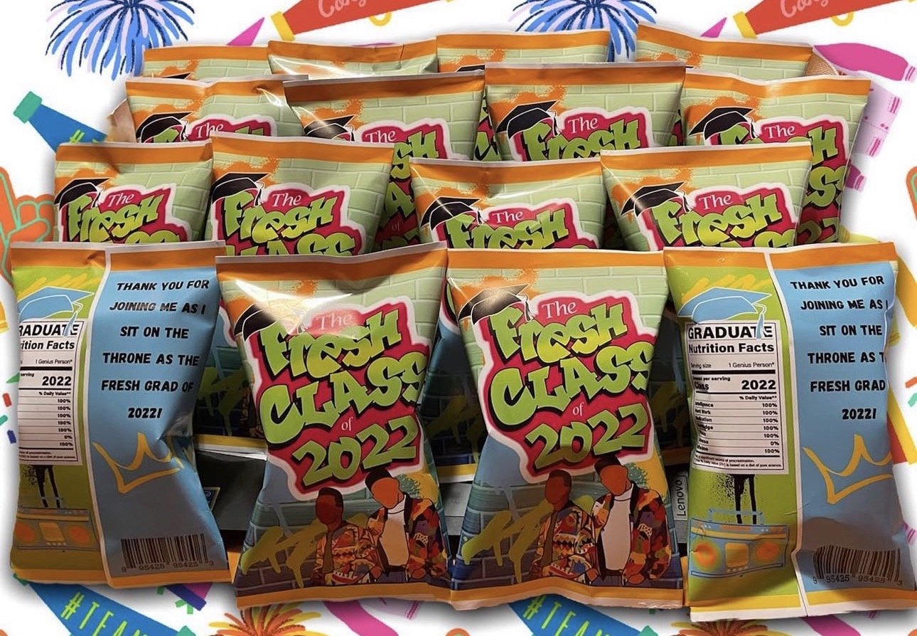 Multiple bags of snack chips with a graduation-themed background and a message for a graduating class of 2022.