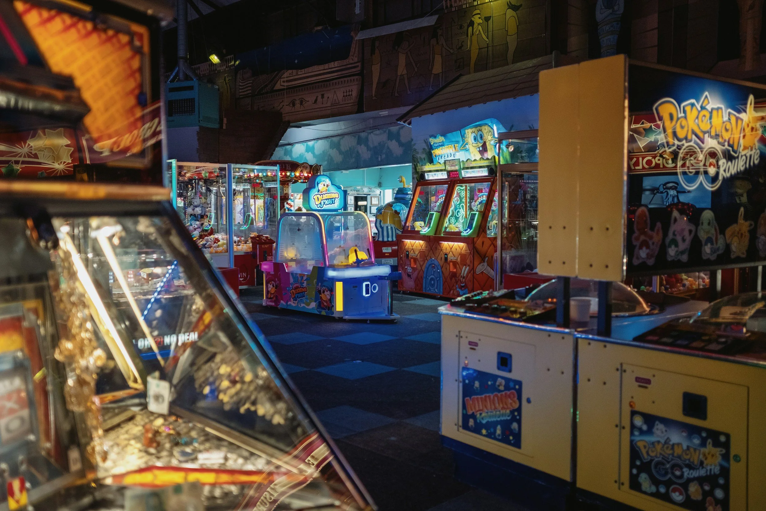 A view of an empty arcade with a variety of games