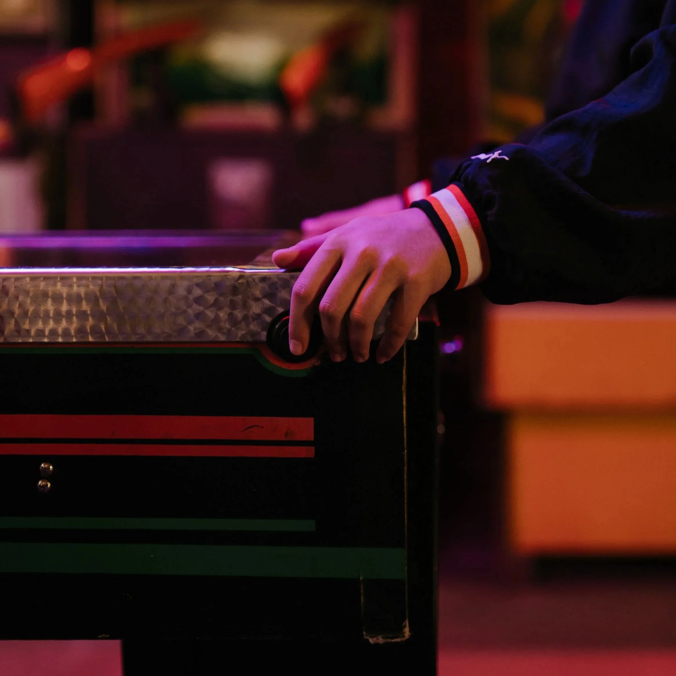 Person using a pinball machine