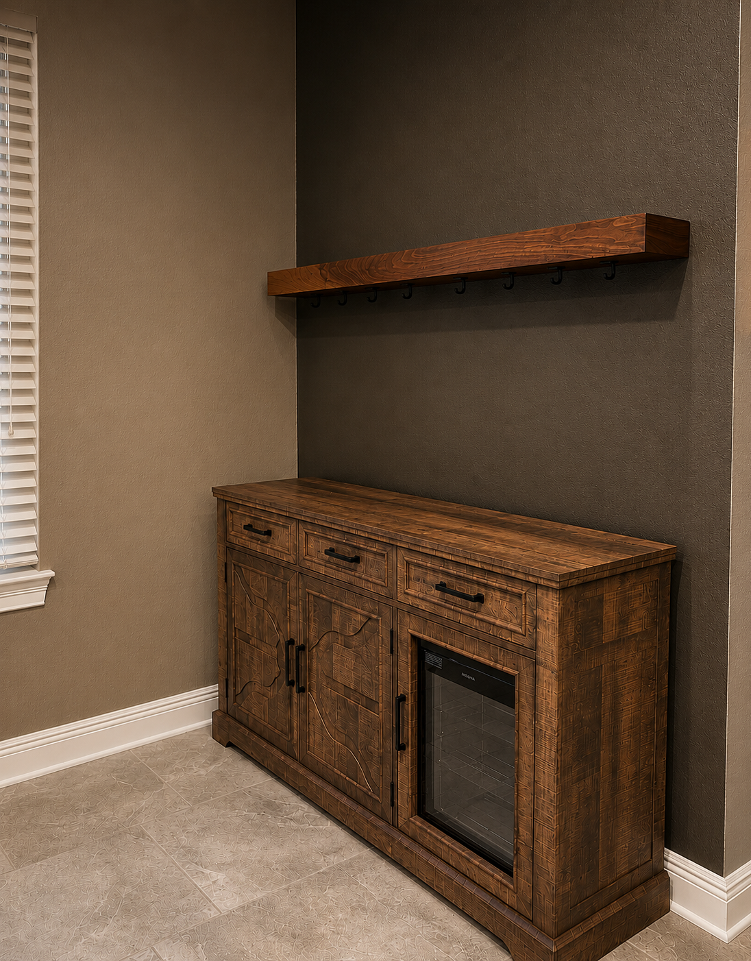 Wooden sideboard with drawers and cabinet doors, a built-in small wine cooler, and a shelf with hooks above, against a dark gray wall in a room with beige tiled flooring.