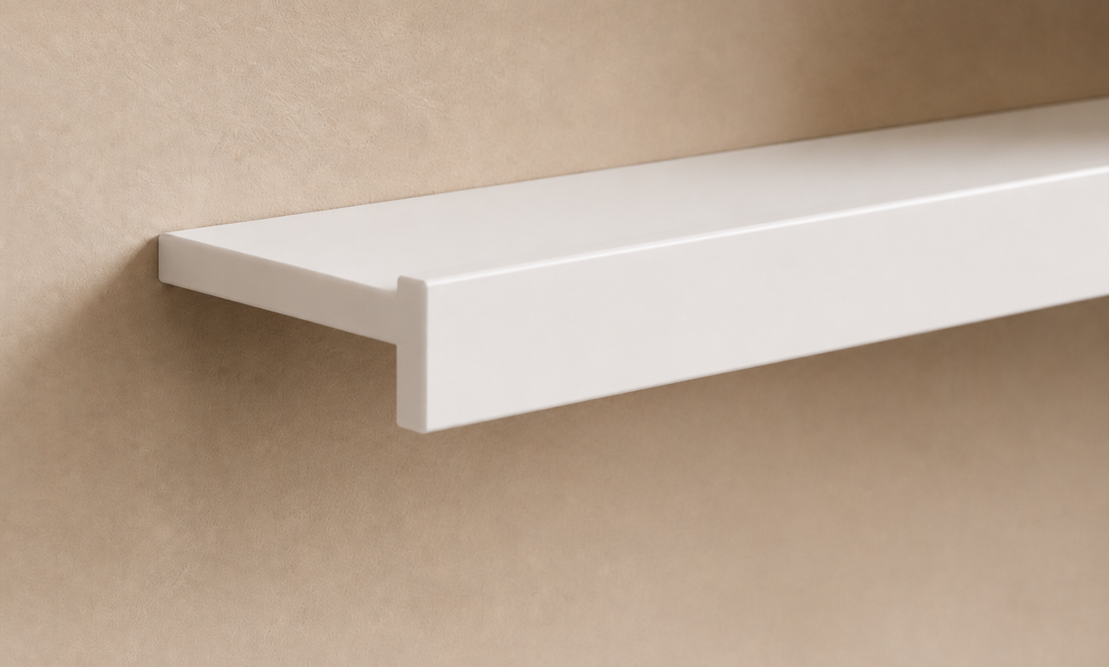 White painted floating shelf mounted on a beige wall.