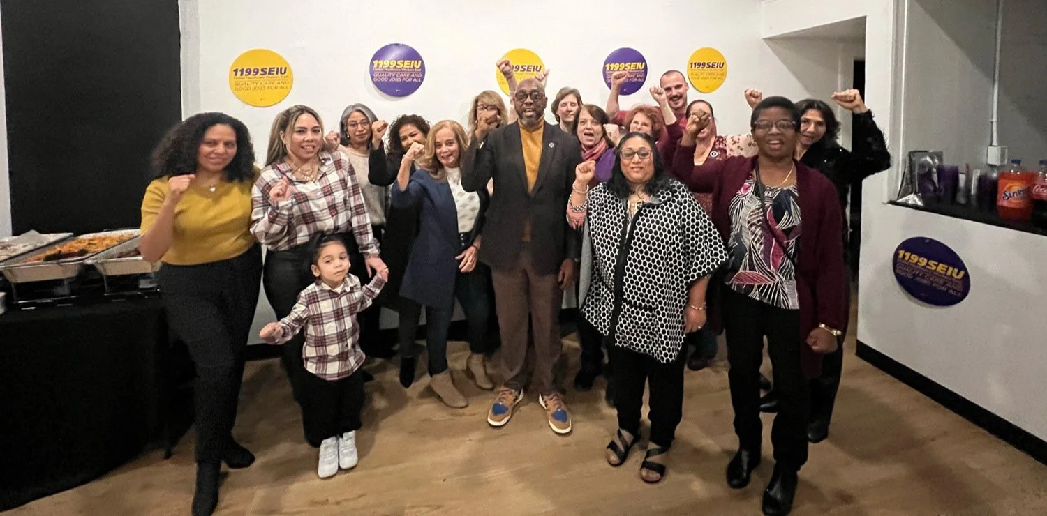 Essex County Commissioner President Wayne Richardson stands with Clara Maass Nurses