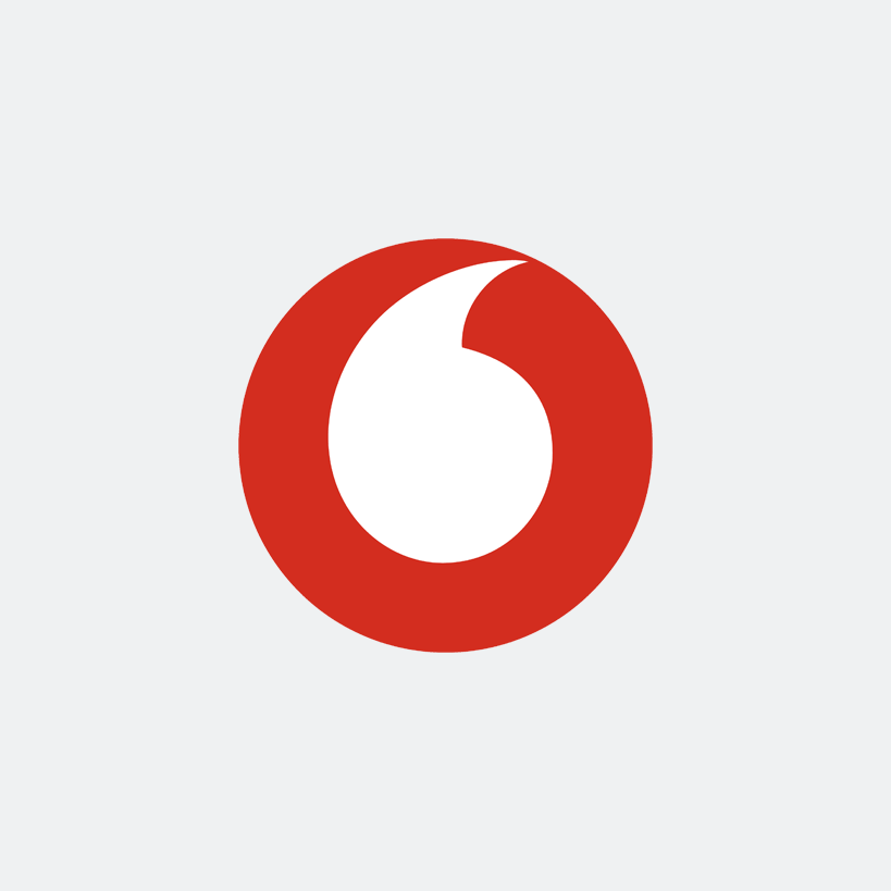 Red circular logo with a white quotation mark center.