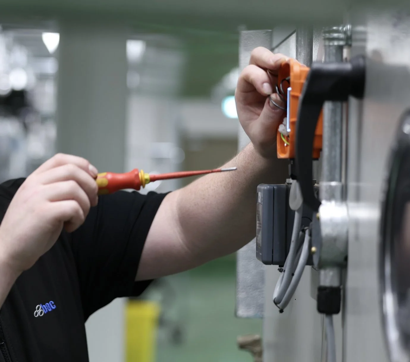 BAC team member maintaining a smart building control system