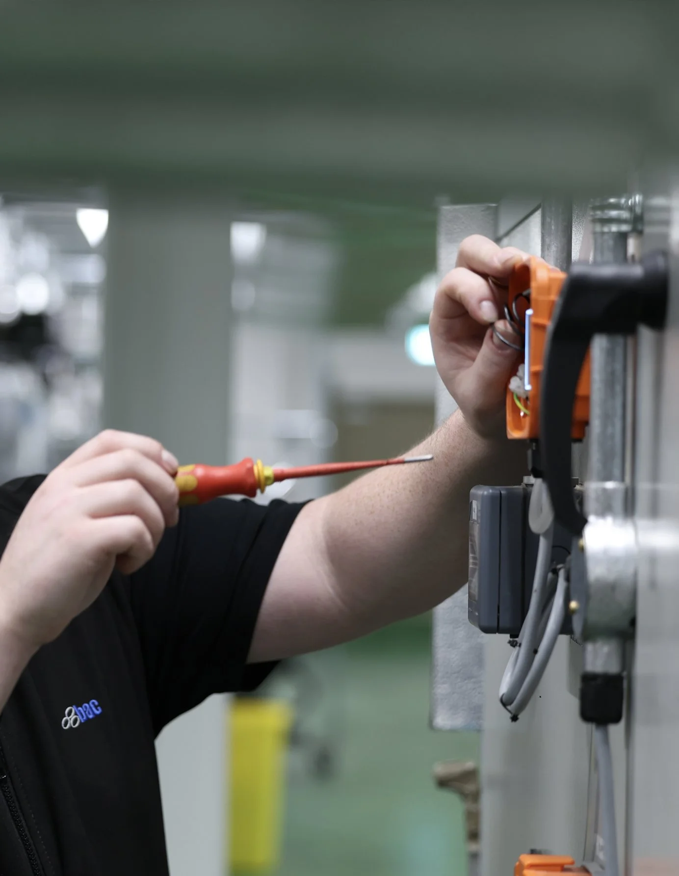 BAC team member carrying out maintenance a building control system