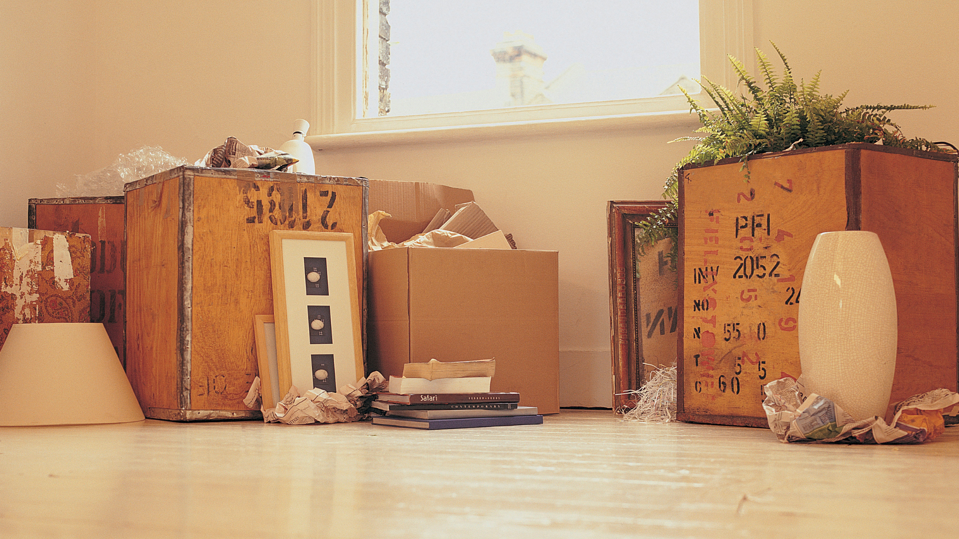 Decluttering and packing household items during Swedish Death Cleaning and downsizing.