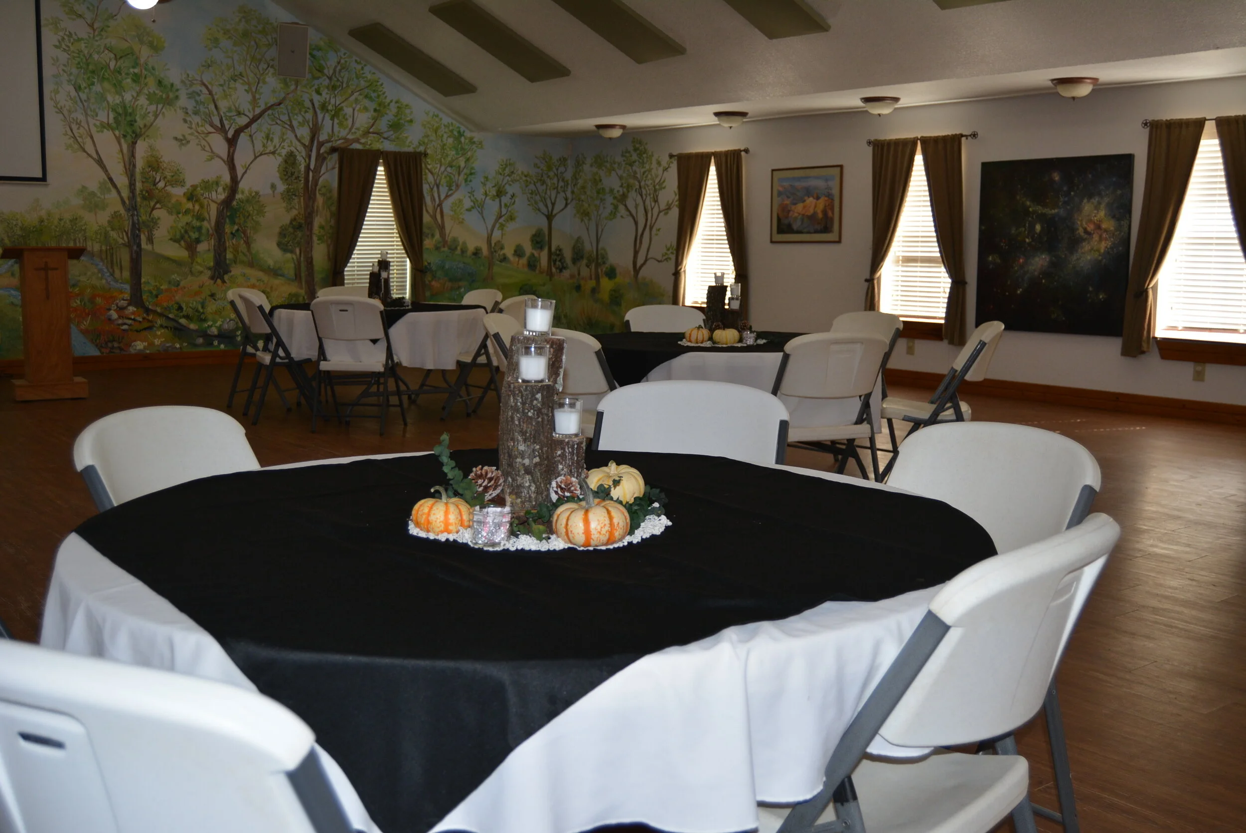 Indoor venue with tables and chairs