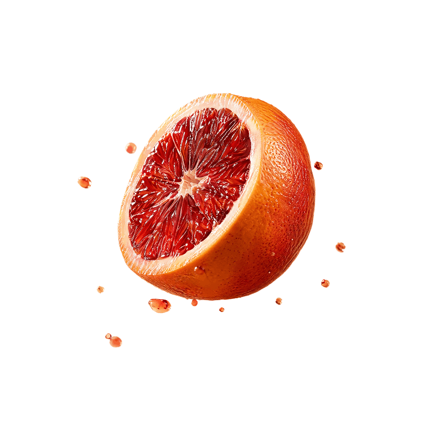 Half of a blood orange with juice droplets around it against a black background.