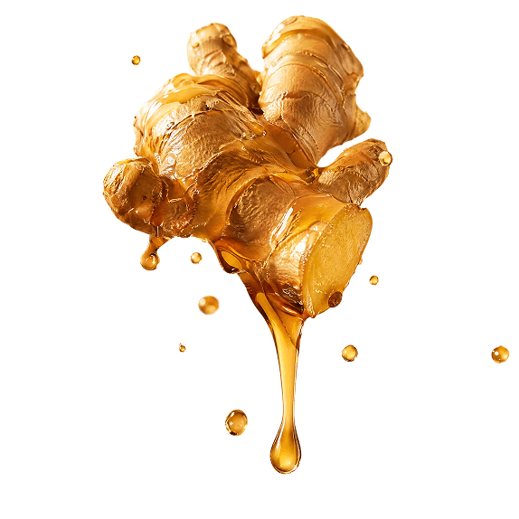 Fresh ginger root dripping with honey, with honey droplets around it, set against a black background.