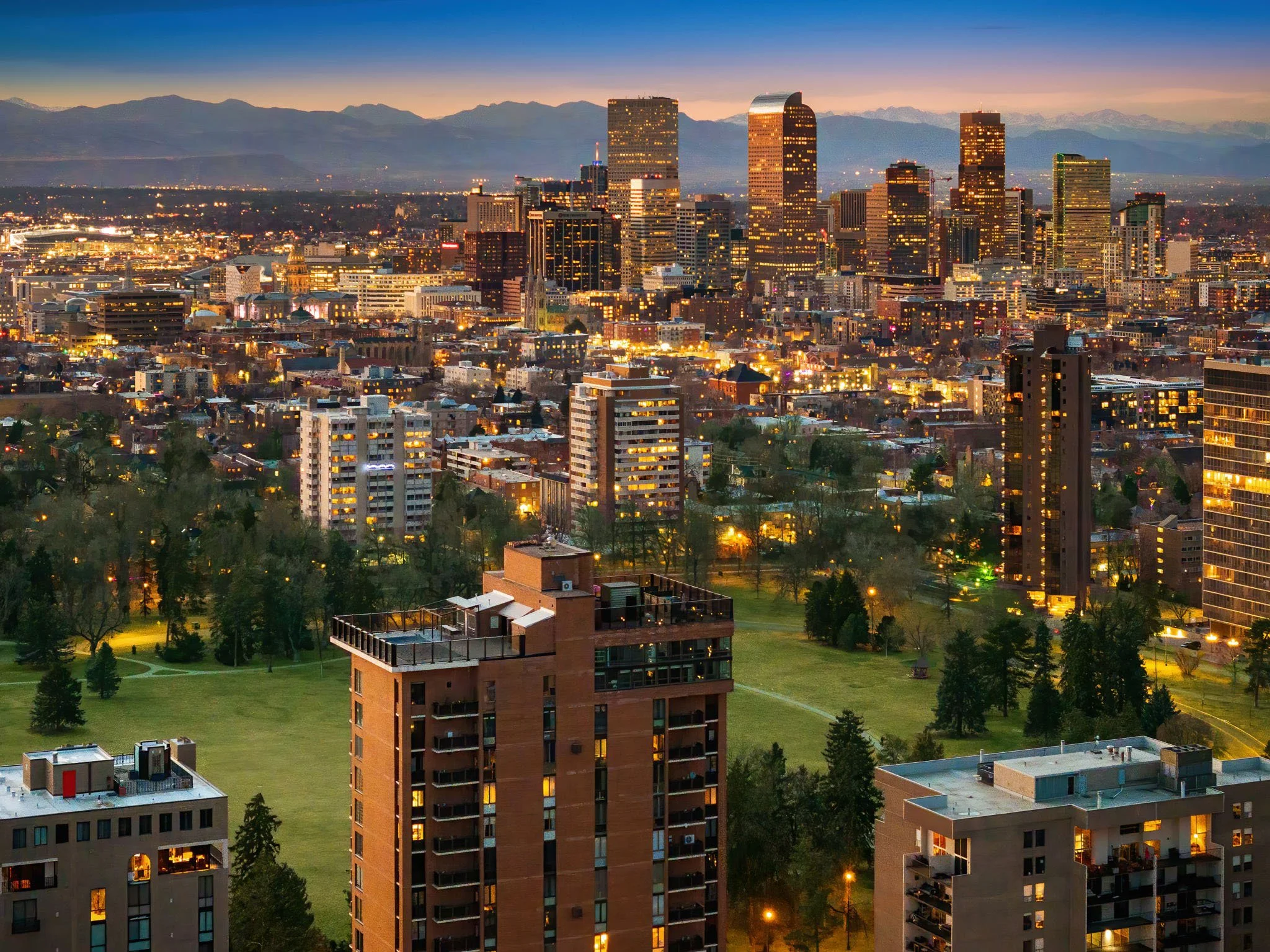 a photo of huntington house in denver, colorado on cheesman park, overlooking downtown and skyline.