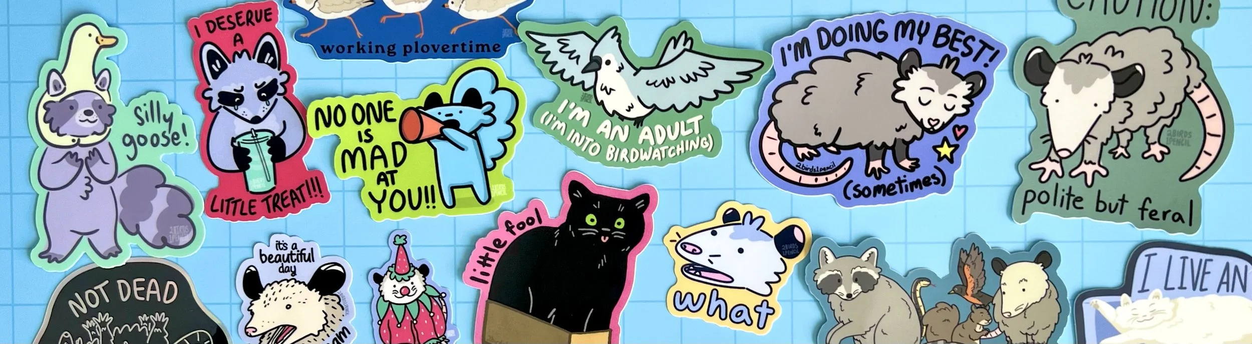 An array of brightly colored, silly animal stickers against a blue background.