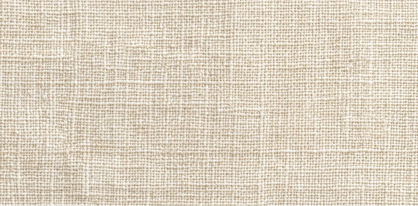Close-up view of beige woven fabric texture with visible fibers and pattern.