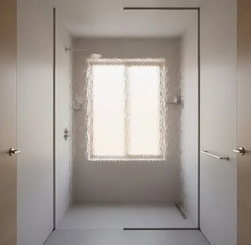 Empty shower with a frosted window and white tiled walls