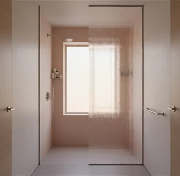 A bathroom shower with a frosted glass door, a window, and a built-in shelf with toiletries.