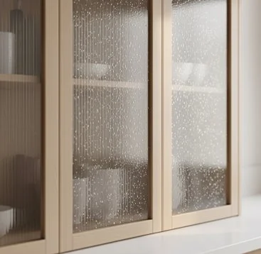 Glass cabinet doors with water droplets or condensation on the surface.