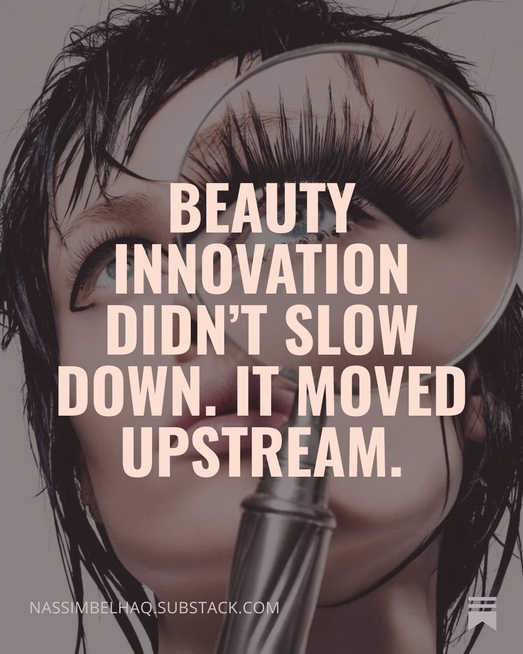 Close-up of a woman with wet hair holding a mirror with long false eyelashes visible. Overlaid text reads, 'Beauty innovation didn't slow down. It moved upstream.'