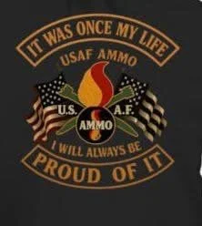 A badge or patch with the U.S. Air Force logo, flags, and flames, reading 'It was once my life, USAF ammo, I will always be proud of it.'
