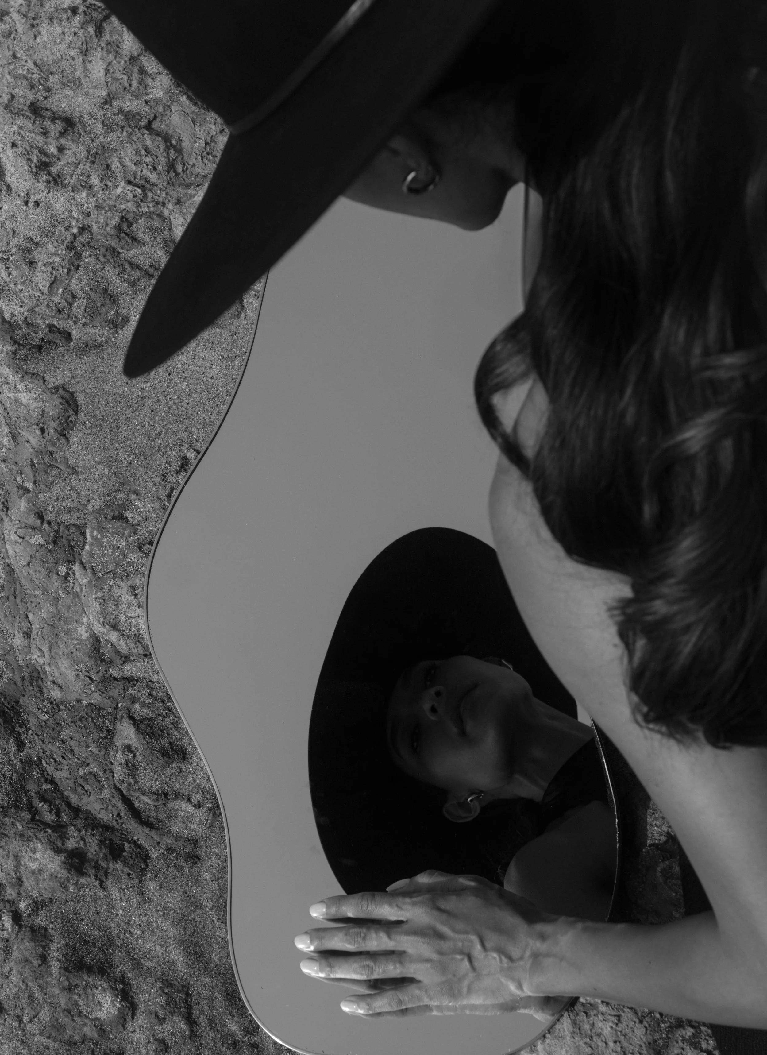 Model wearing a black hat from The Halo Collection by The Halo Lab