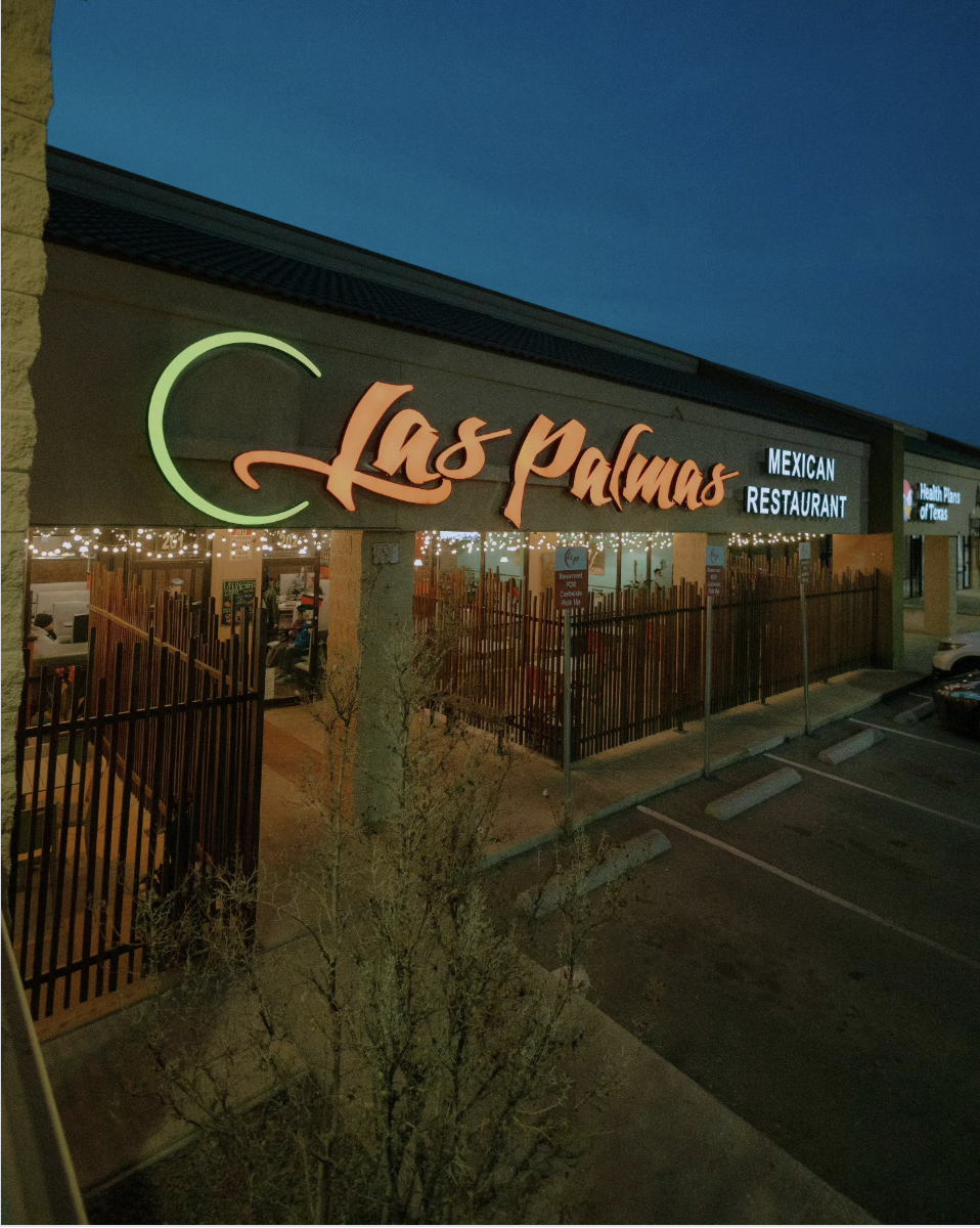 Exterior of Las Palmas Mexican Restaurant at dusk, with illuminated sign and parking lot in foreground.