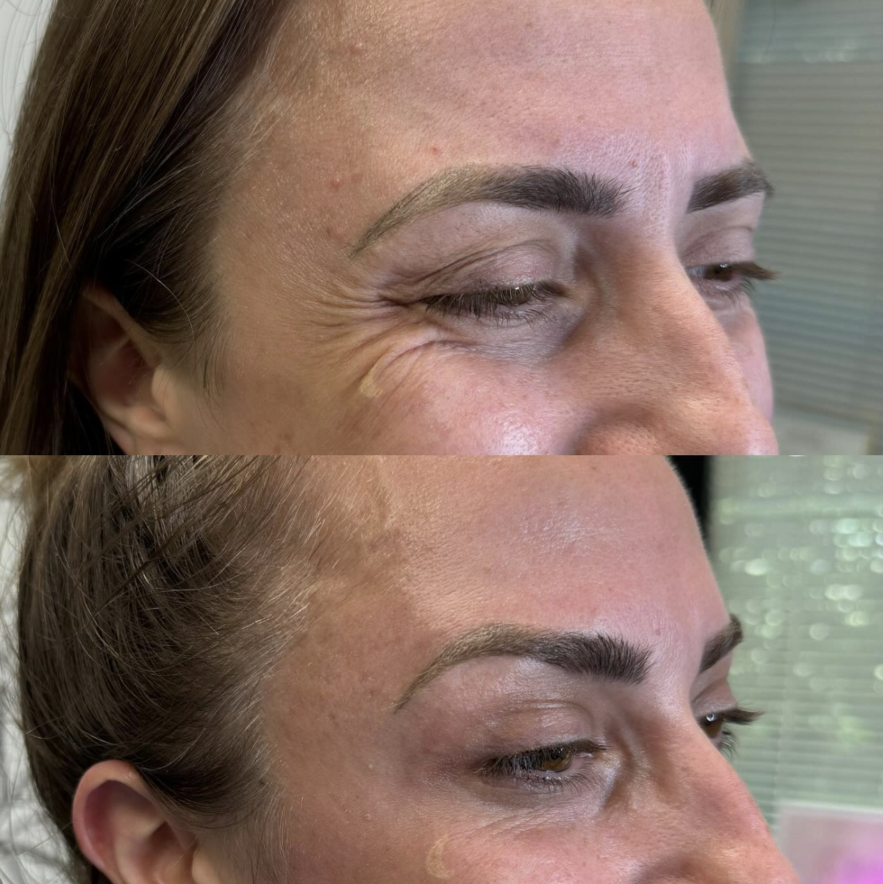 Person holding a tall, cylindrical ceramic vase with a gradient design from dark gray at the top to light gray at the bottom, featuring vertical ribbed texture near the base.