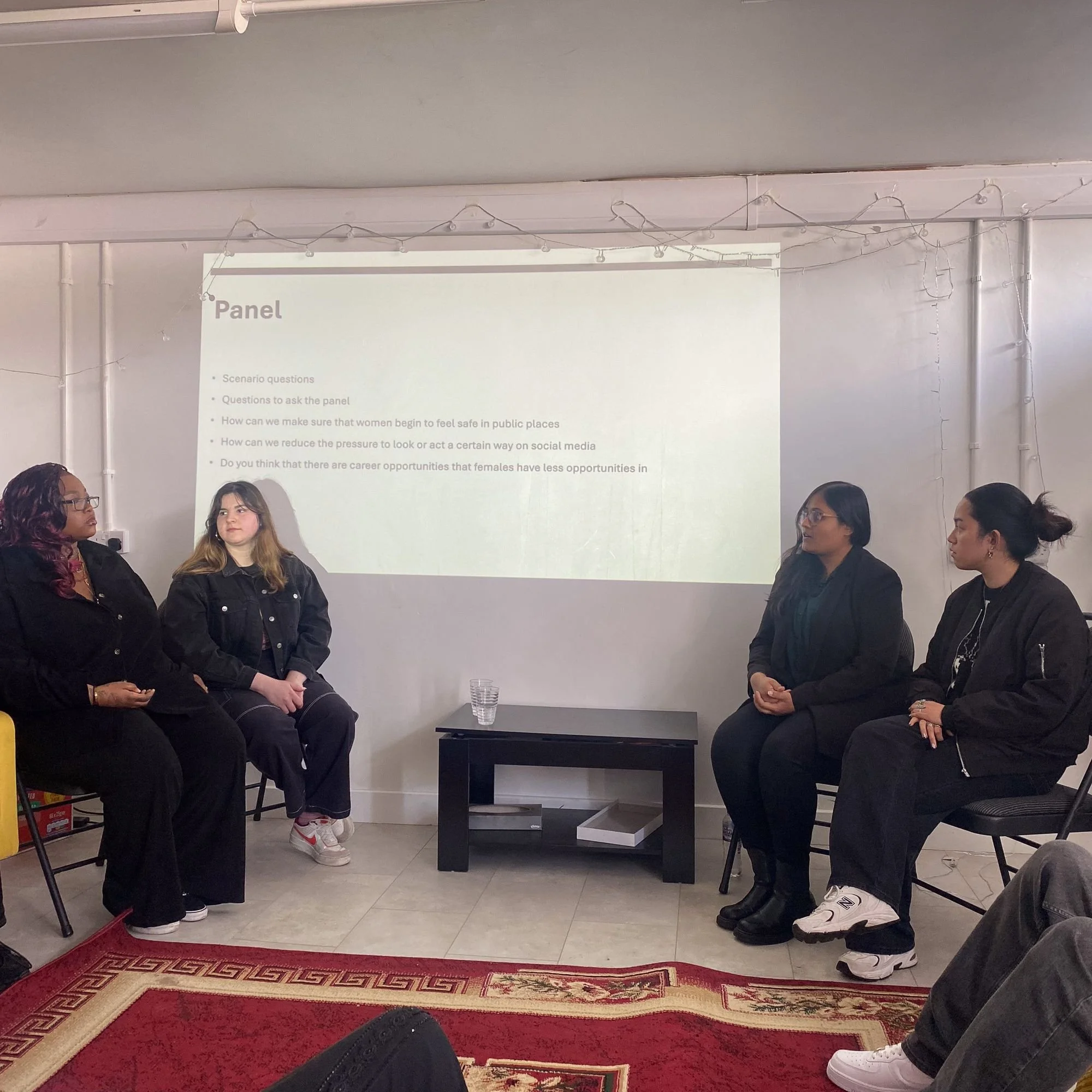 A group of young people delivering a panel discussion