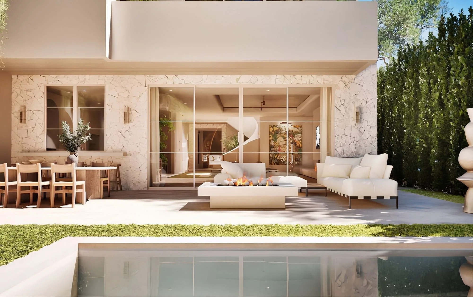 Modern house with stone exterior, large glass sliding doors, outdoor seating area with a fire feature, a pool, and lush trees in the background.