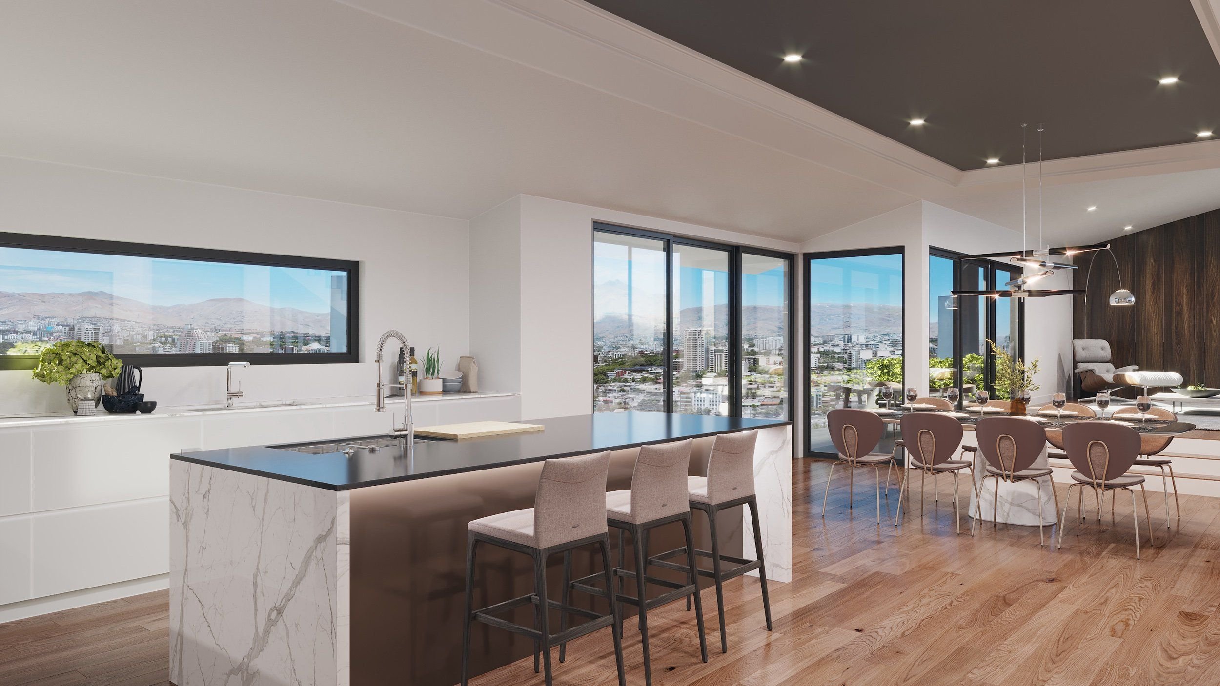 Modern open-concept living space with a kitchen and dining area, floor-to-ceiling windows offering city and mountain views, white cabinetry, marble island, beige chairs at the kitchen counter, a round dining table with chairs and wine glasses, a cozy