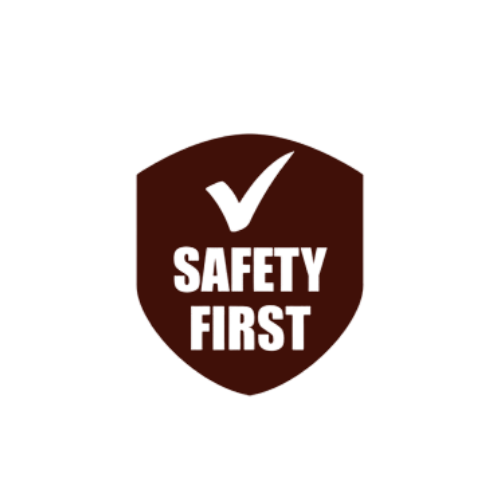 A shield-shaped sign with a check mark and the text "SAFETY FIRST" in bold black letters.
