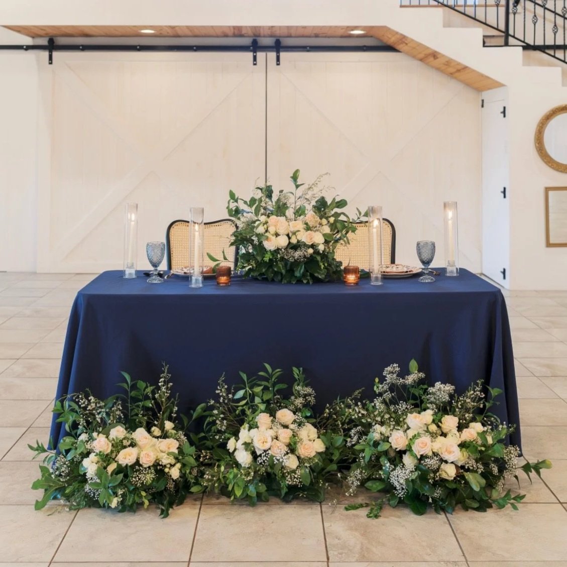 Romantic Wedding Reception flowers with soft neutral blooms and greenery by wedding florist Izalena Floral House.