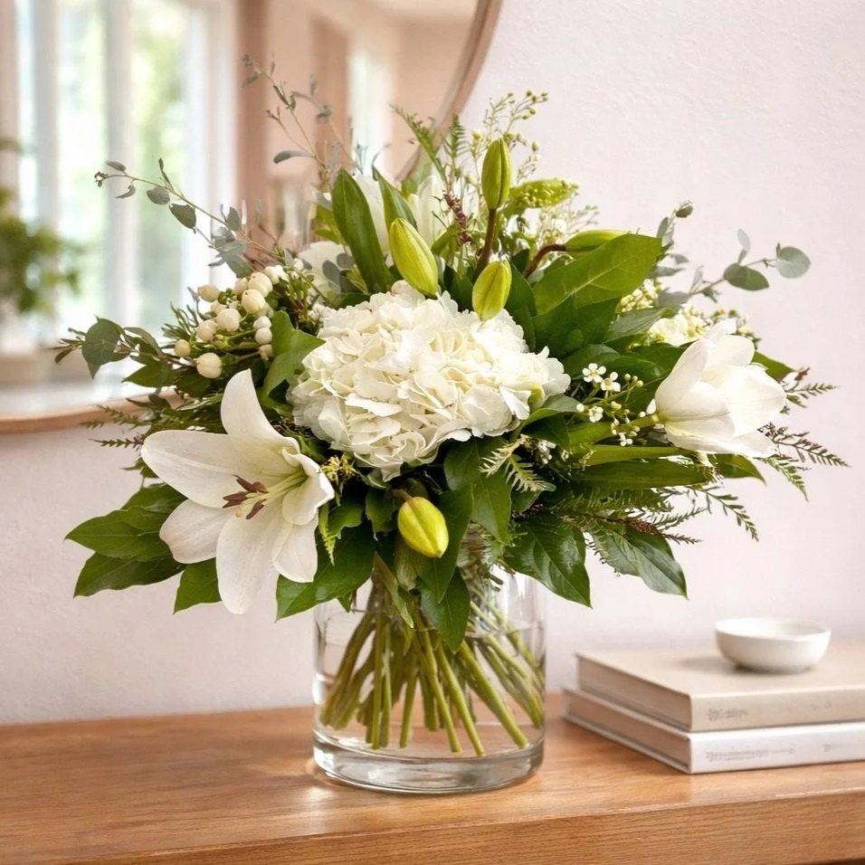 Romantic Wedding bouquet with soft neutral blooms and greenery by wedding florist Izalena Floral House.