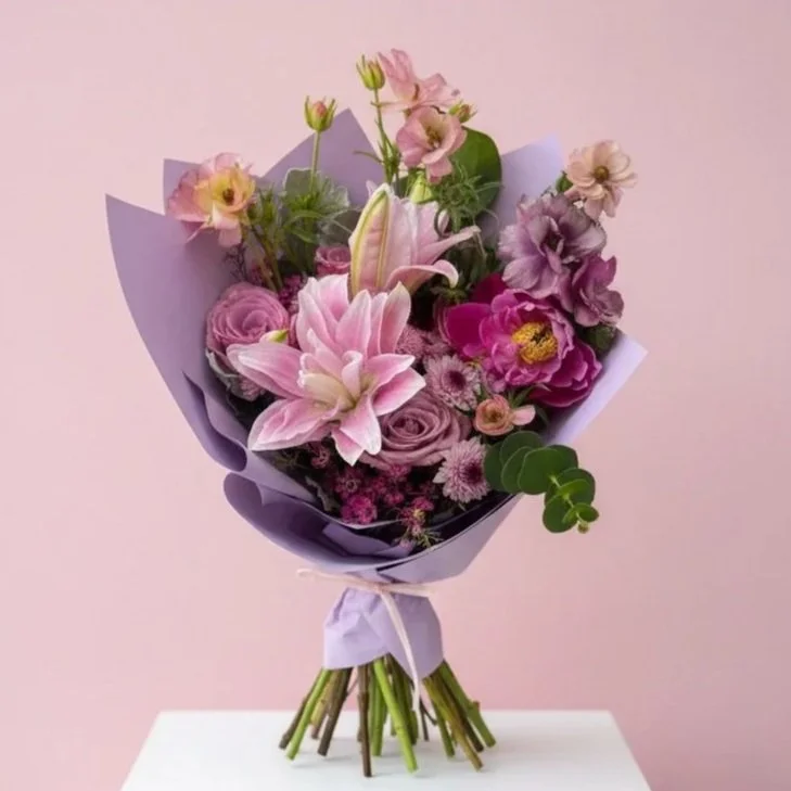 Romantic Wedding bouquet with soft pink blooms and greenery by wedding florist Izalena Floral House.