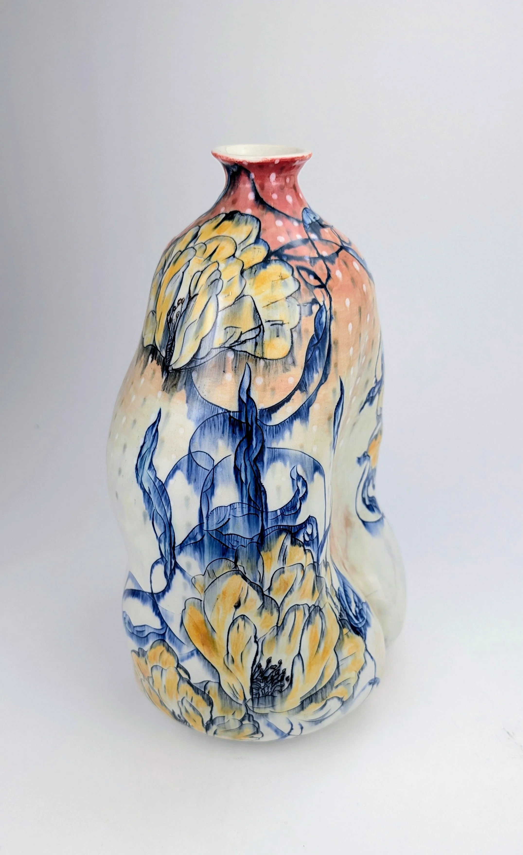 Elegant ceramic vase with hand-painted floral design in yellow, blue, and black on a cream background.