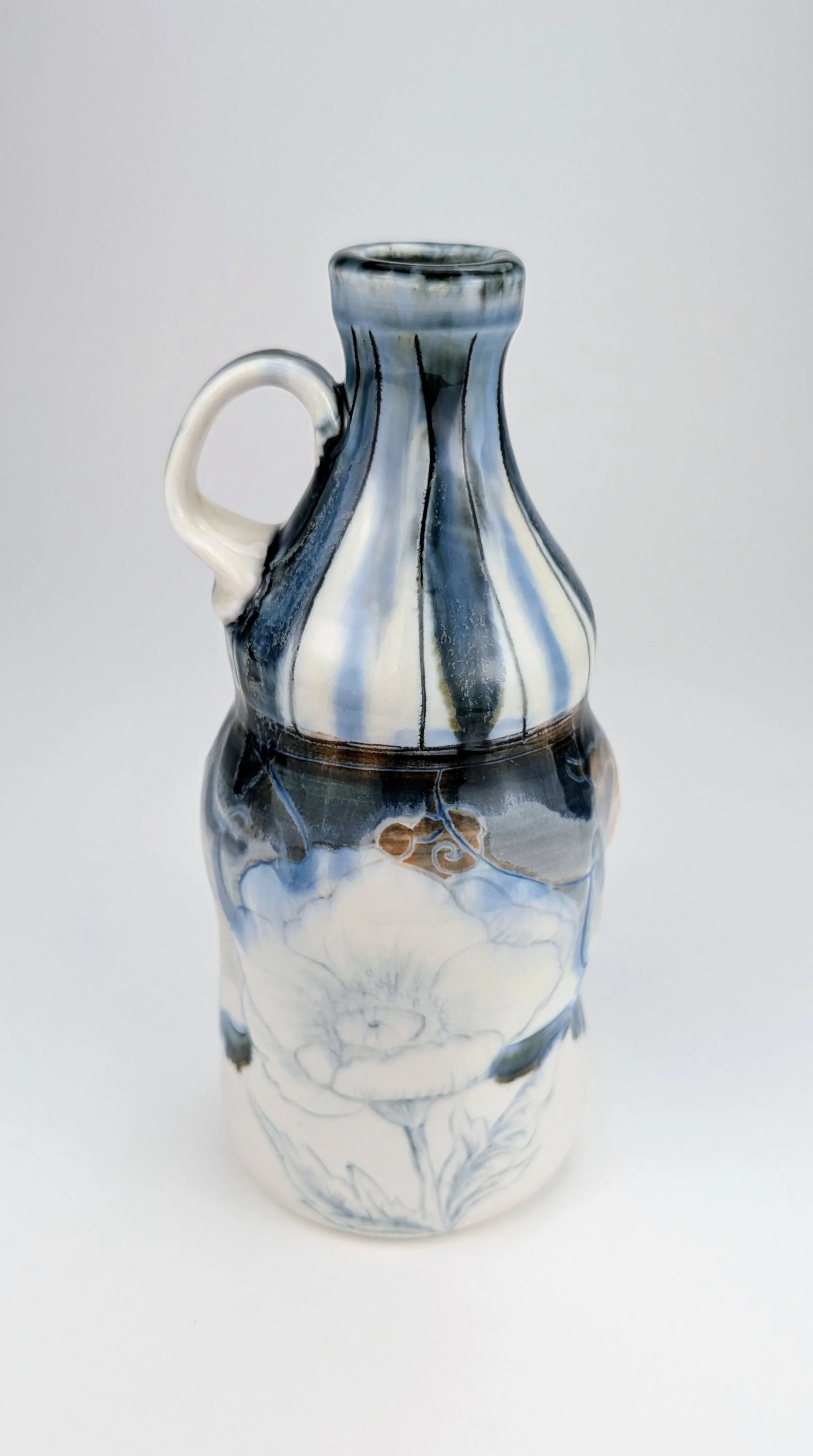 Ceramic porcelain figurative Bottle, with inlayed cobalt Mishima, layered glazes, and underglaze.