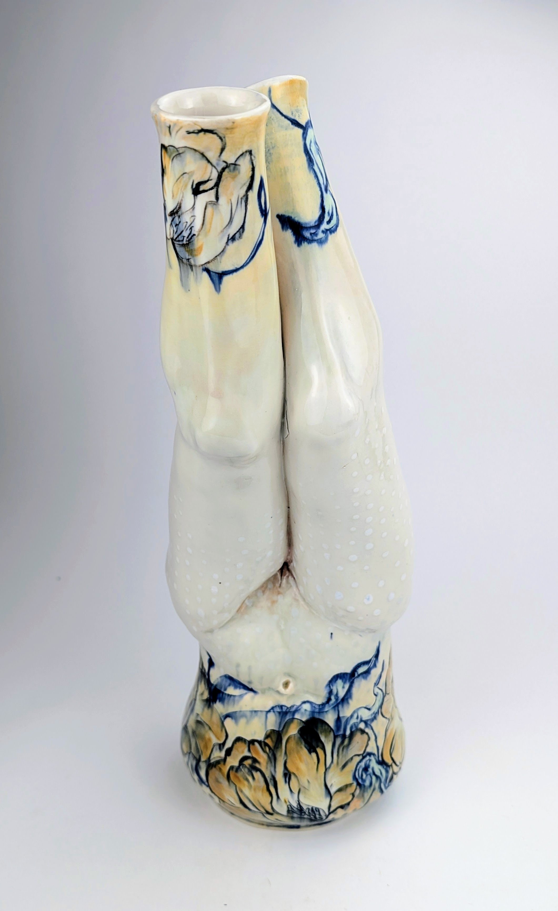 Ceramic porcelain figurative vessel, with inlayed cobalt Mishima, layered glazes, and underglaze.