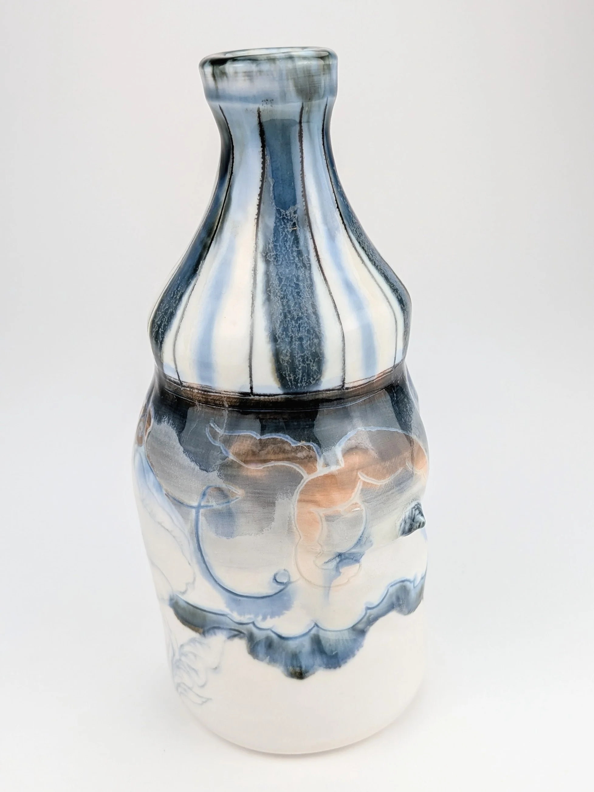 Ceramic porcelain figurative Bottle, with inlayed cobalt Mishima, layered glazes, and underglaze.