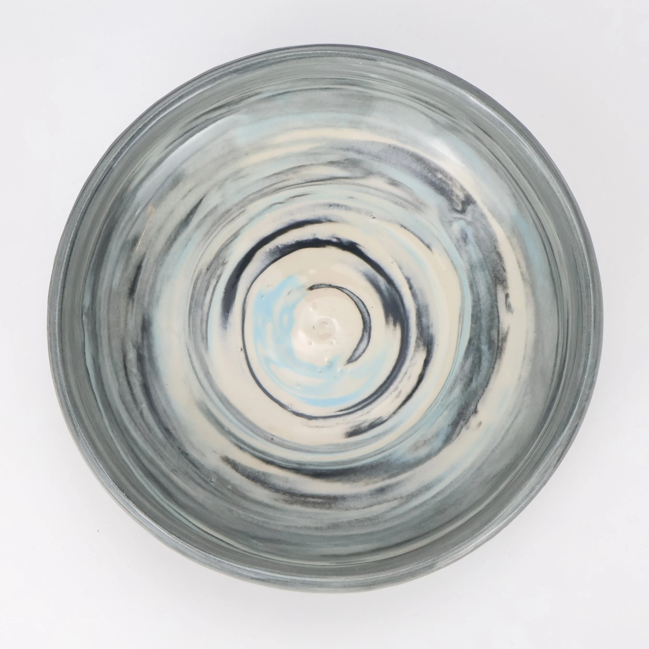 Top view of a Marbled Porcelain Blate set against a white background.