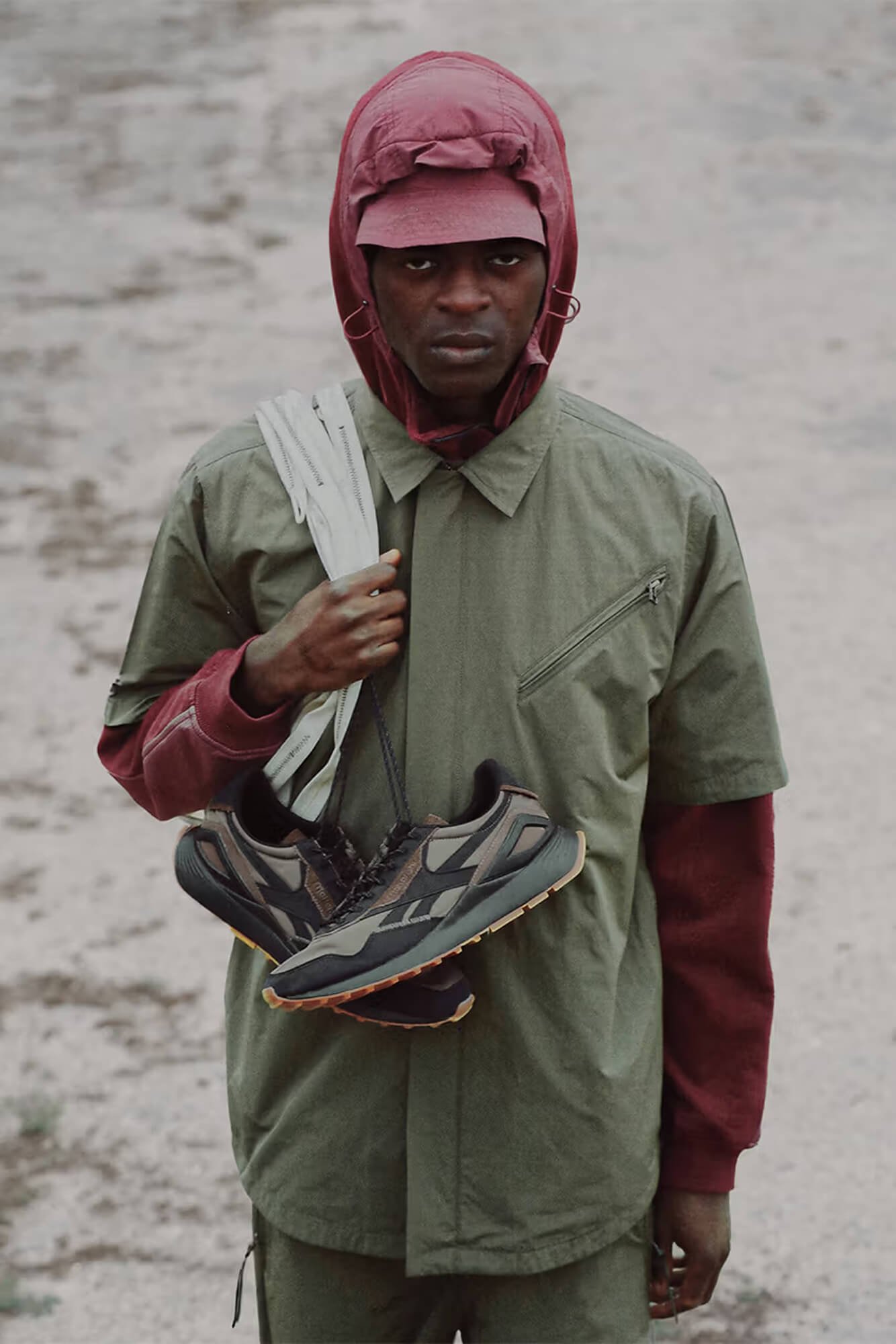 13_Reebok+Maharishi+LegacyAZ_Model+HoldingShoes_13.jpg
