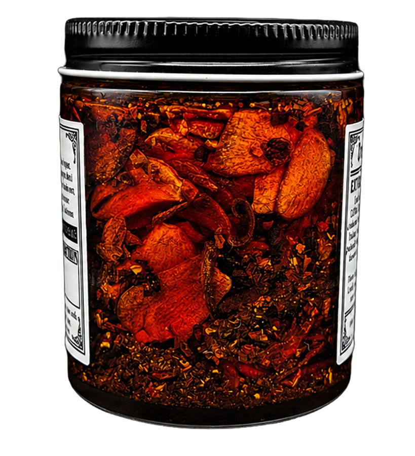 A glass jar of  umami, chili crisp, avocado oil