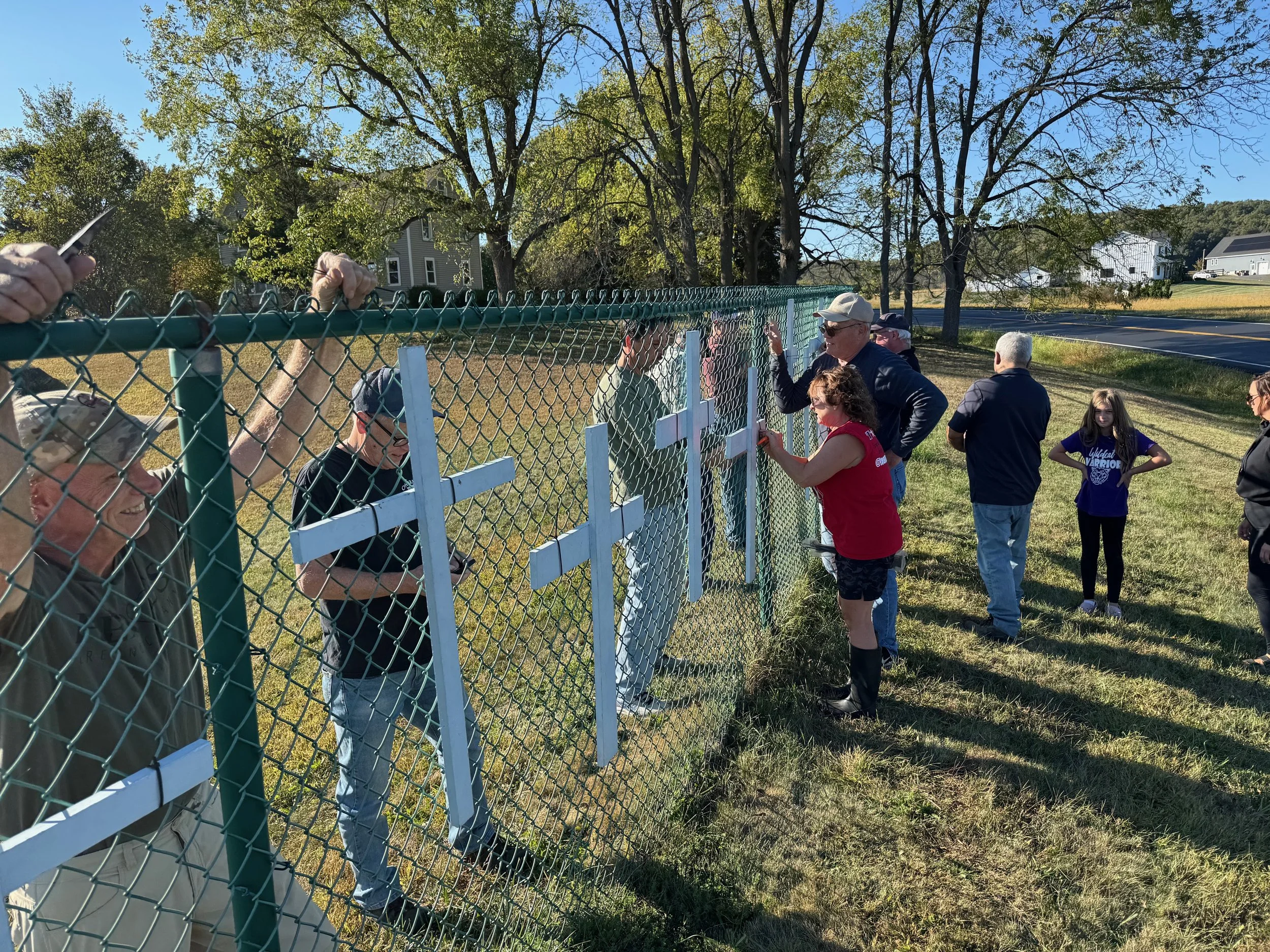 Helping Right to Life Ministry Hang Crosses on Penning's Fence Oct. 2025