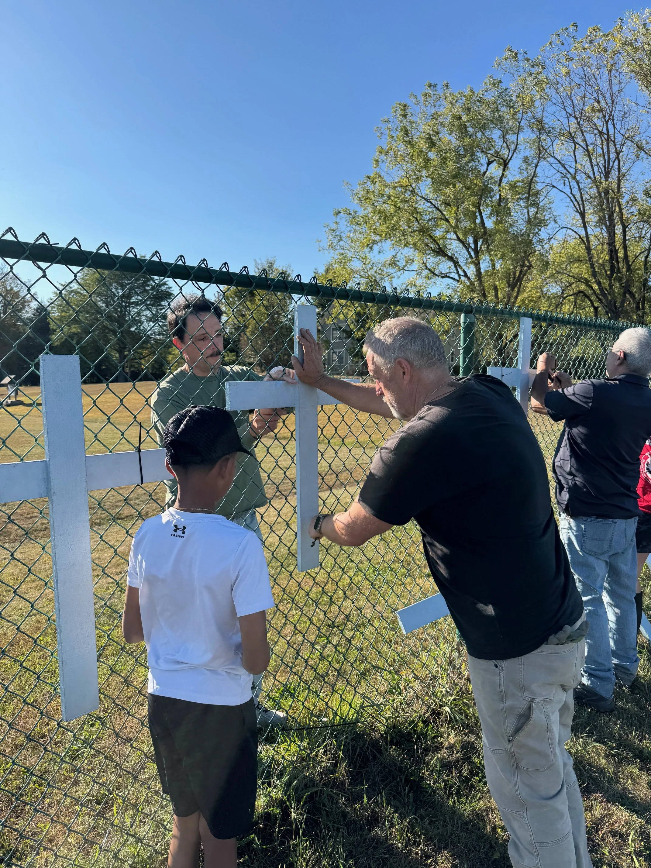 Helping Right to Life Ministry Hang Crosses on Penning's Fence Oct. 2025