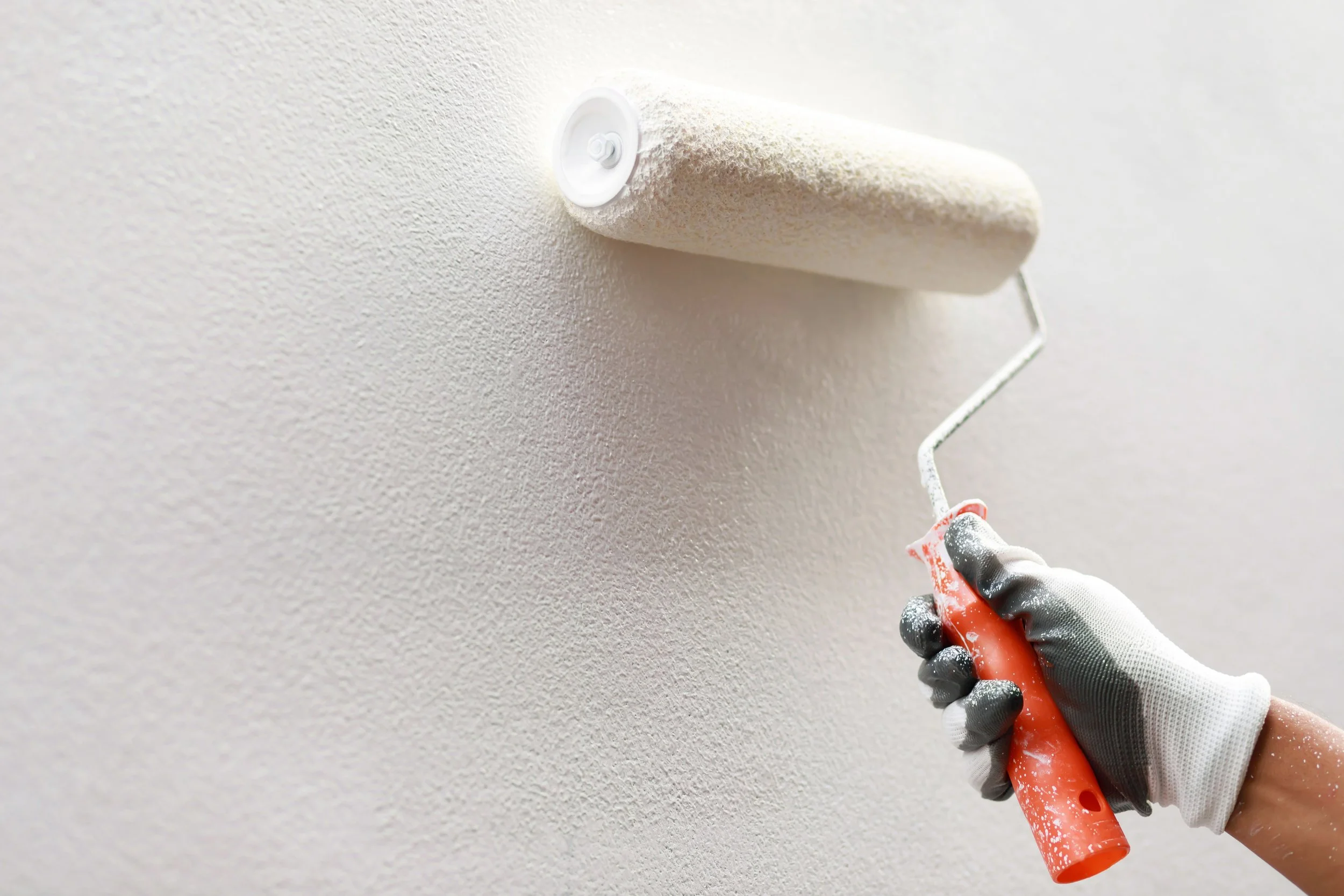 vecteezy_roller-brush-painting-worker-painting-on-surface-wall_21851767.jpg