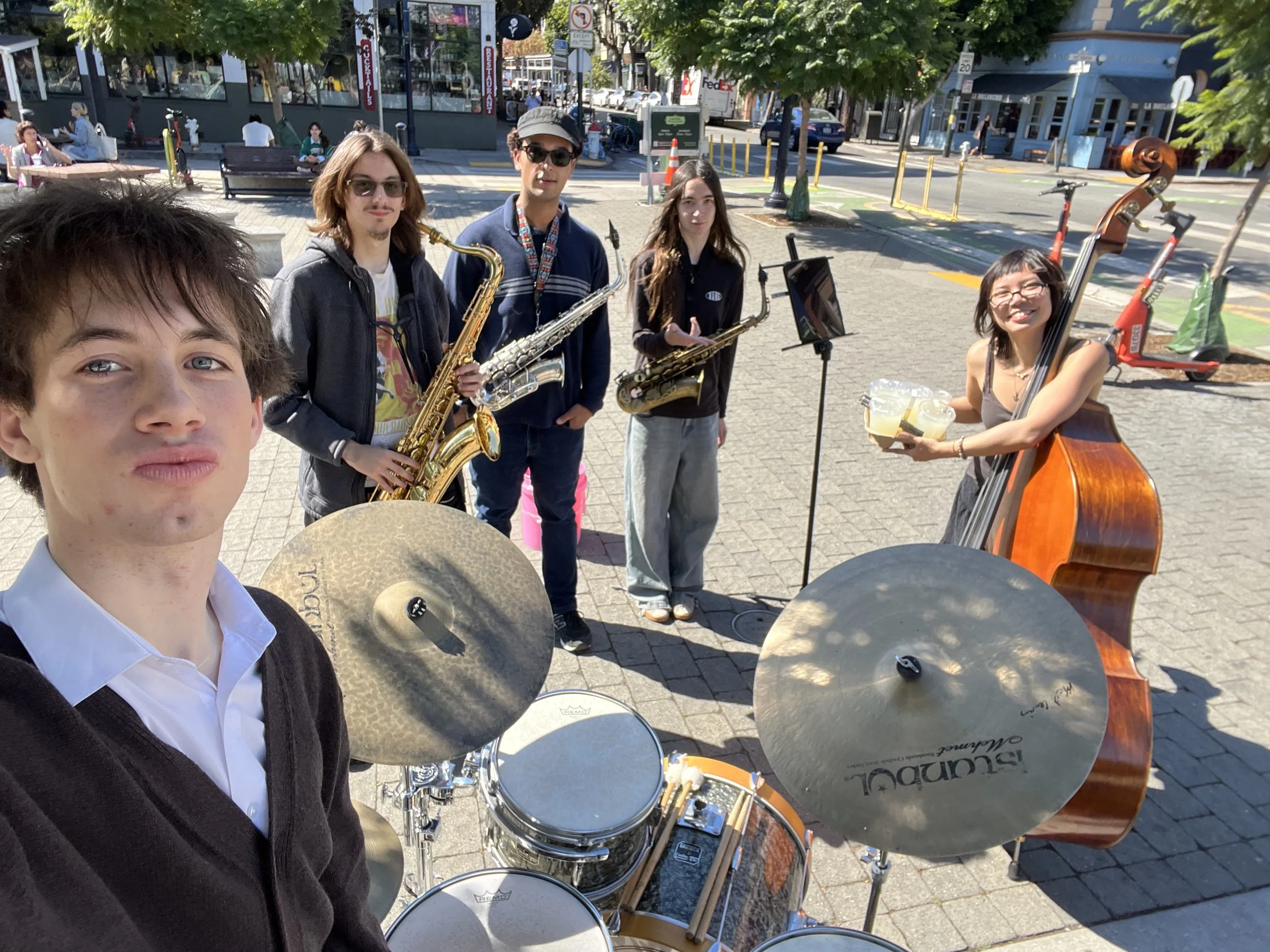 Rio Forchini, Regina Magpoc, Maxwell Goldfield-Brown, Maya Fu, and Joshua Johnston busking in Hayes Valley San Francisco