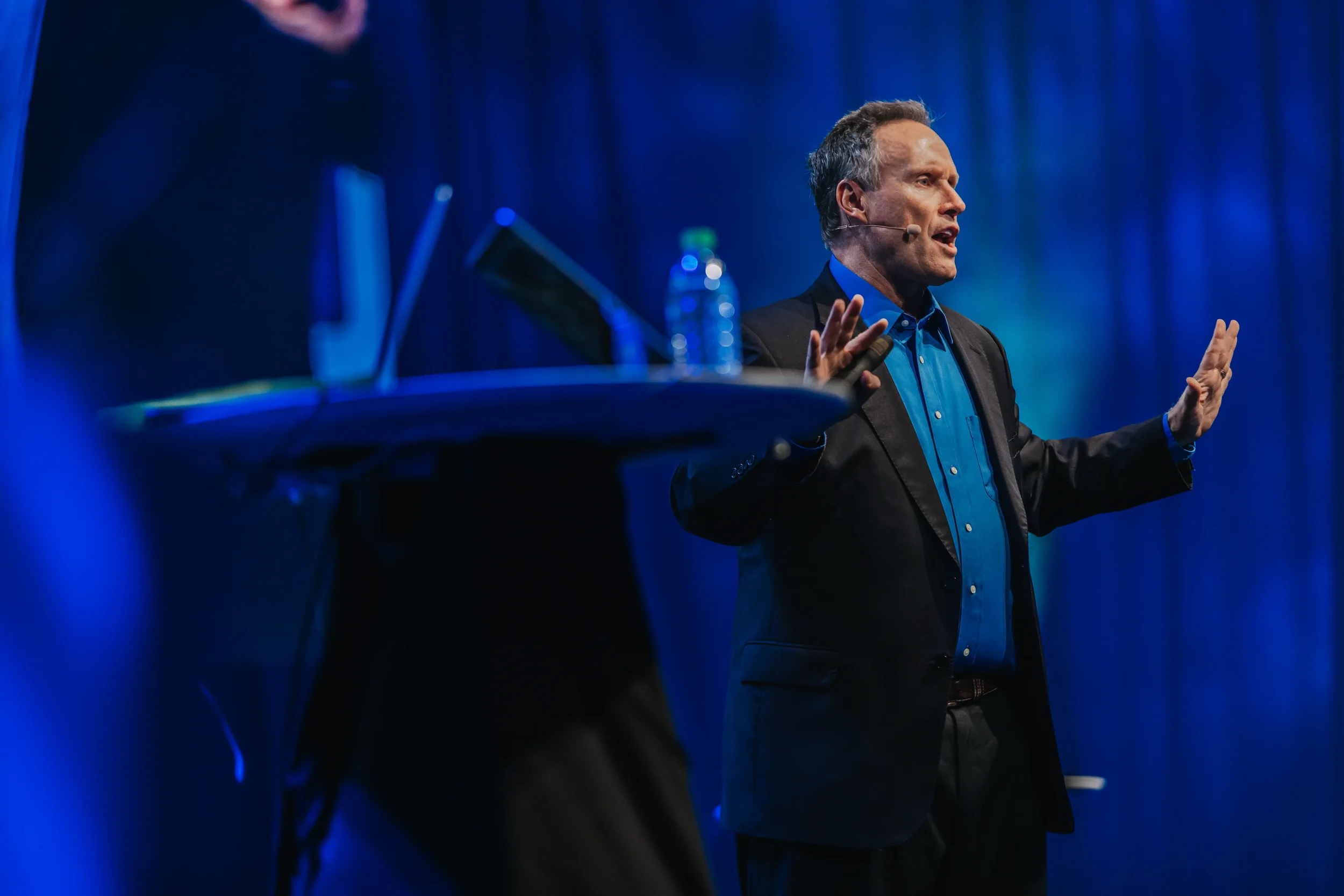 Speaker presenting on stage at technology conference in San Francisco