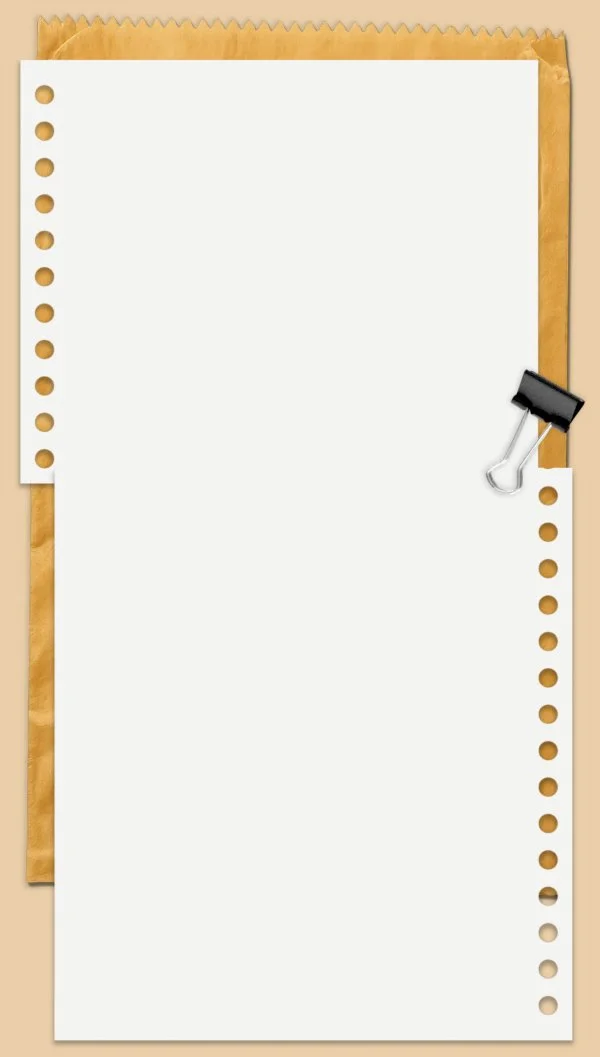 A piece of white notebook paper clipped onto a sheet of lined paper on a beige background.