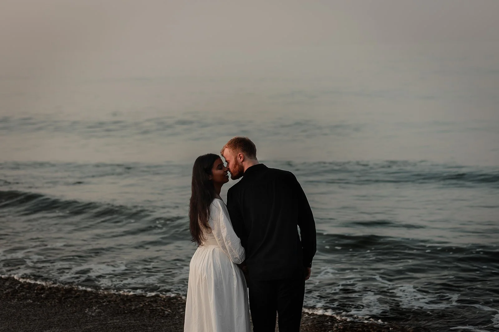 A couple sharing a kiss taken by couple photographer Darius N Fernandes on the coast of Goa as he traveled from the Netherlands