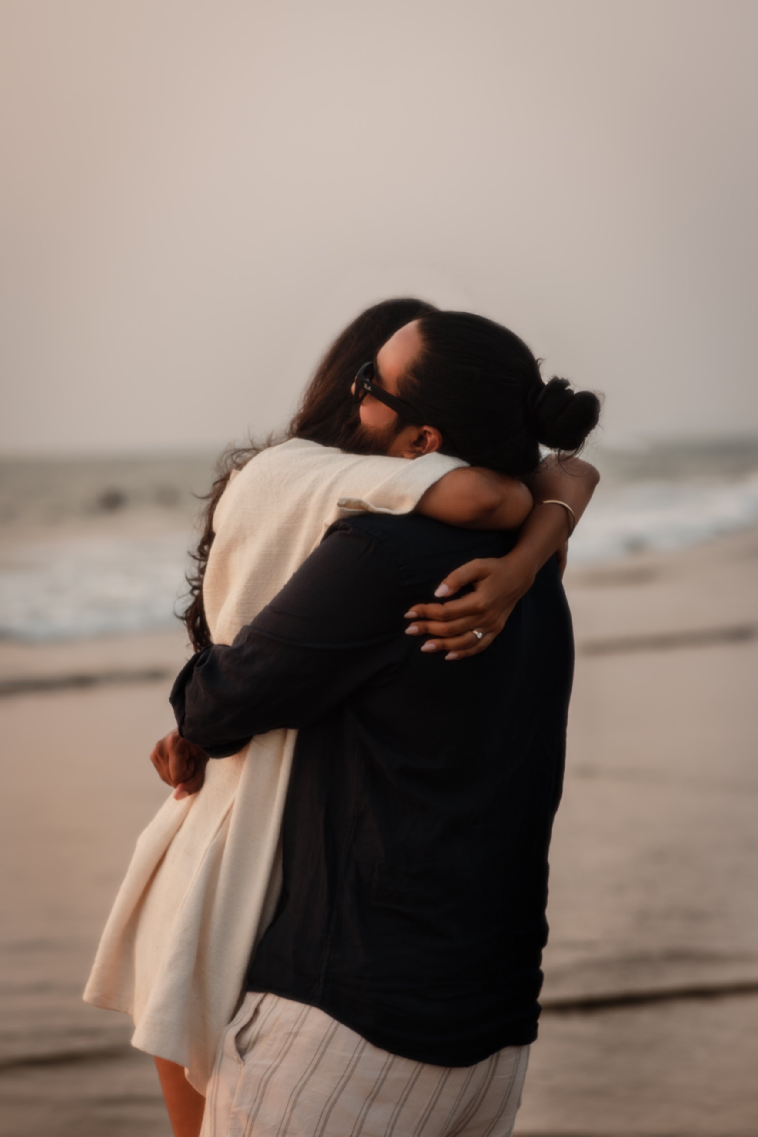 A very candid moment of when a couple went in for a emotional hug, photographed by Darius  from the Netherlands in Goa 