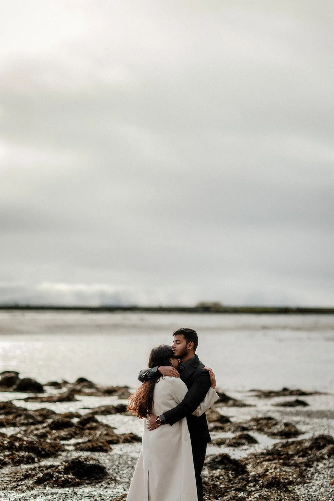 A couple sharing a tight embrace in the cold taken by Darius 